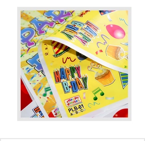 Detailed close-up of plastic party favor bag with colorful Happy Birthday patterns