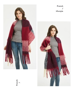 Detail of red and grey plaid tassel scarf with French lifestyle aesthetic text