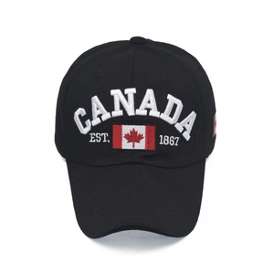 Detailed close-up of embroidered CANADA 1867 text and red maple leaf on black cotton cap