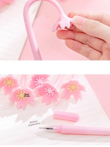 Detail of pink cherry blossom gel pen showing the soft silicone floral topper and fine tip