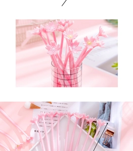 Detailed close-up of pink cherry blossom silicone pens in a desktop organizer