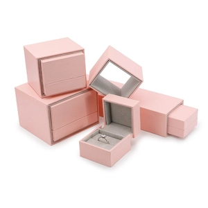 Pink velvet jewelry gift boxes set for rings necklaces and bracelets on white background
