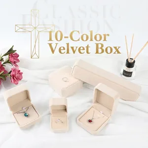 Classic beige velvet jewelry box set for rings and necklaces on white silk background