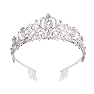 Elegant silver bridal tiara with intricate hollow patterns and shimmering crystals on white background