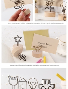 Close-up of vintage wooden note holders with various wire shapes for desktop decoration