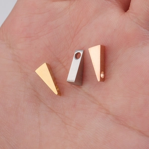 Polished triangle geometric charms in gold, silver, and rose gold finishes