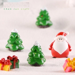Christmas snowman resin miniature set with Santa Claus and gift boxes on snow