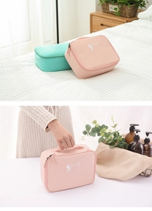 Detailed view of portable travel cosmetic bags with wide handle and dual zipper closure
