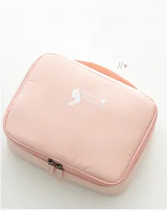 Detail view of pink travel toiletry bag made of memory fabric with portable handle