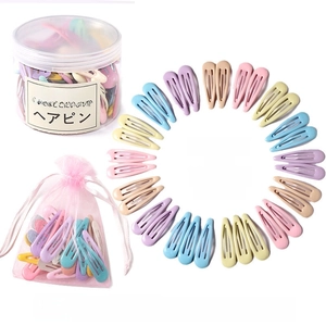 Detailed set of 32 macaron candy color snap hair clips with storage jar and gift bag