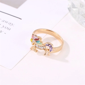 Detail of unicorn ring featuring colorful enamel mane and sparkling crystal accents
