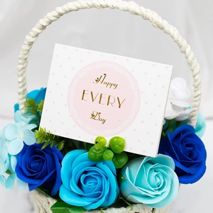 Handcrafted woven basket with blue soap roses and a Happy Every Day greeting card
