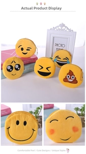 Macro view of plush emoji coin purses with detailed embroidery and metal bead chains