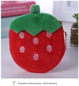 Detail of plush strawberry coin purse with soft texture and metal bead chain