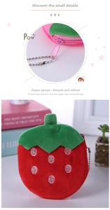 Detail of pink zipper and strawberry plush purse with silver metal bead chain