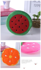 Detail of plush fruit pouches with embroidery and zipper closure in various cute shapes