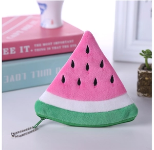 Detailed macro view of a plush watermelon slice coin purse with soft texture and vibrant colors