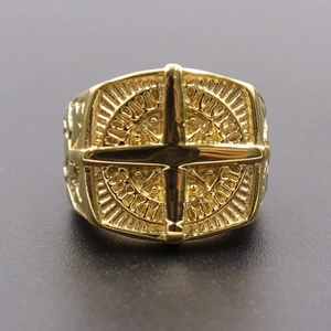 Macro view of gold Freemason ring featuring intricate engraving and Masonic square emblem
