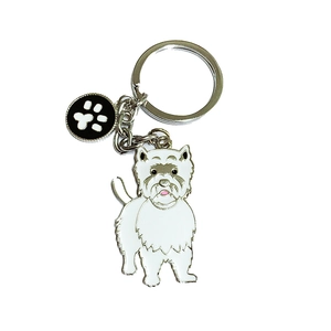 Metal keychain featuring a white Westie dog charm and black paw print pendant on white background
