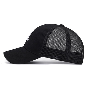Black mesh baseball cap with white embroidered U-letter patch on a clean white background