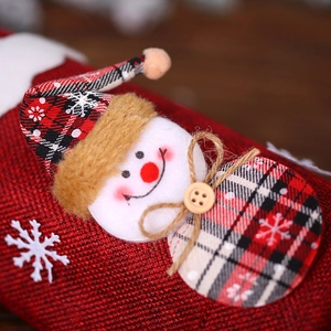 Christmas burlap wine bottle cover with plush snowman and red checkered snowflake hat