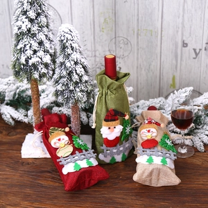Three festive Christmas burlap wine bottle bags with Santa and snowman 3D felt decorations
