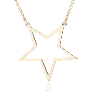 Detail of gold hollow star pendant with polished finish on a fine stainless steel chain