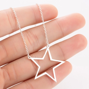 Minimalist stainless steel hollow star pendant necklace with shiny metallic finish