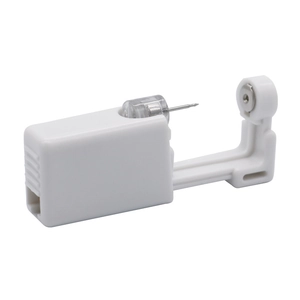 Side view of white disposable ear piercing tool with medical grade steel needle