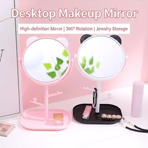 Rotating cat ear tabletop makeup mirror with pink frames and jewelry storage branch stand