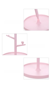 Pink tree-shaped jewelry organizer with heart-tip branches and storage base tray