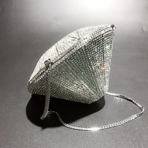 Detailed view of the diamond-shaped evening bag featuring sparkling crystal rhinestones