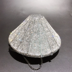Macro detail of silver diamond-shaped evening clutch with full crystal rhinestones