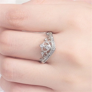 Elegant silver crown ring for women featuring cubic zirconia stones on the finger