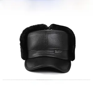 Front view of black textured leather winter hat with thick faux fur ear flaps and logo