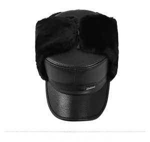 Top view of men's winter leather trapper hat with thick faux fur lining and metal logo