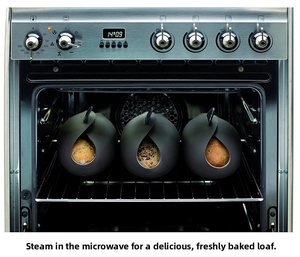 Three black silicone bread makers baking fresh buns inside a professional kitchen oven