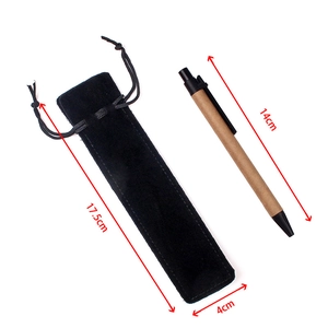 Black velvet drawstring pouch 17.5x4cm with ballpoint pen on white background