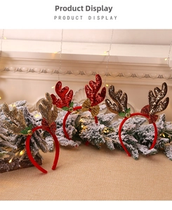 Detailed view of festive reindeer antler headbands with glitter, bows and gold bells
