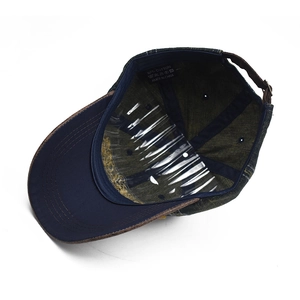 Detailed view of 100% cotton inner lining and adjustable metal buckle on denim baseball cap