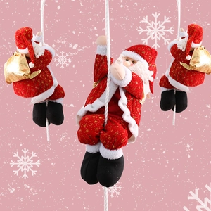 Three decorative Santa Claus figures climbing a white rope for festive Christmas decor