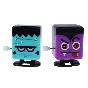 Close-up of wind-up walking Frankenstein and vampire square toys for Halloween gifts