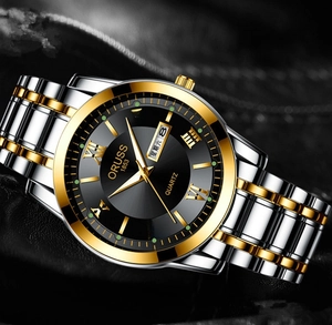 Detail of ORUSS watch dial with gold Roman numerals and dual calendar display window