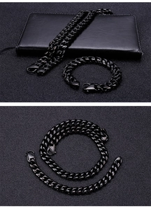 Detail view of black Cuban chain necklace and bracelet set with metallic luster finish