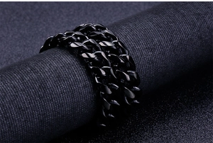 Close-up of black multi-strand Cuban link chain ring for men in punk metal style