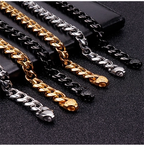 Close-up of cuban link necklaces in gold, silver and black finish with detailed clasps
