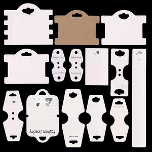 Matrix display of white and kraft jewelry packaging cards for earrings and necklaces