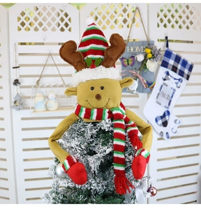 Detail of felt Christmas reindeer tree topper with red-green striped hat and scarf decor
