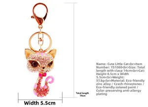 Macro view of cute rhinestone kitten keychain with pink enamel details and rose gold finish