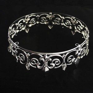 Detail of silver alloy wedding crown with fleur-de-lis patterns and crystal pendants